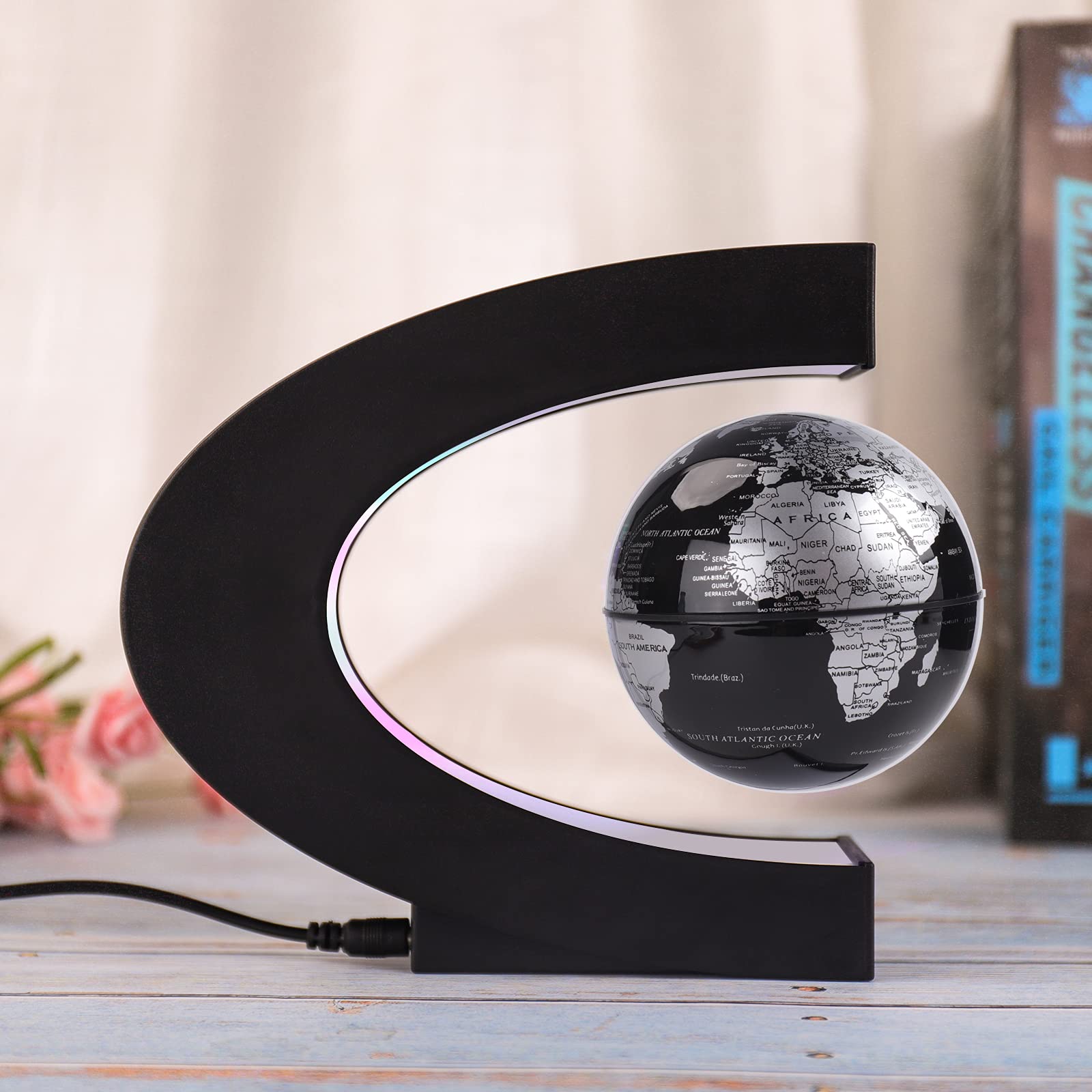 Shoclematirul globe hovering in midair demonstrates magnetic levitation