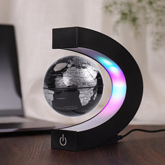 Shoclematirul floating globe with gold LED glow adds a premium touch to any space