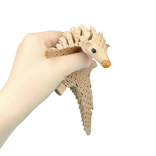 SIPWATE pangolin with dynamic joints for interactive play and desk stress relief.