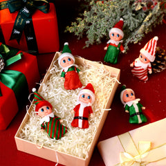 Skylety elf miniatures brighten Christmas tree decorations.