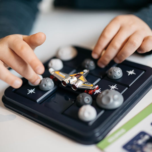 SmartGames Asteroid Escape sliding pieces demonstrate dynamic asteroid navigation for spatial reasoning