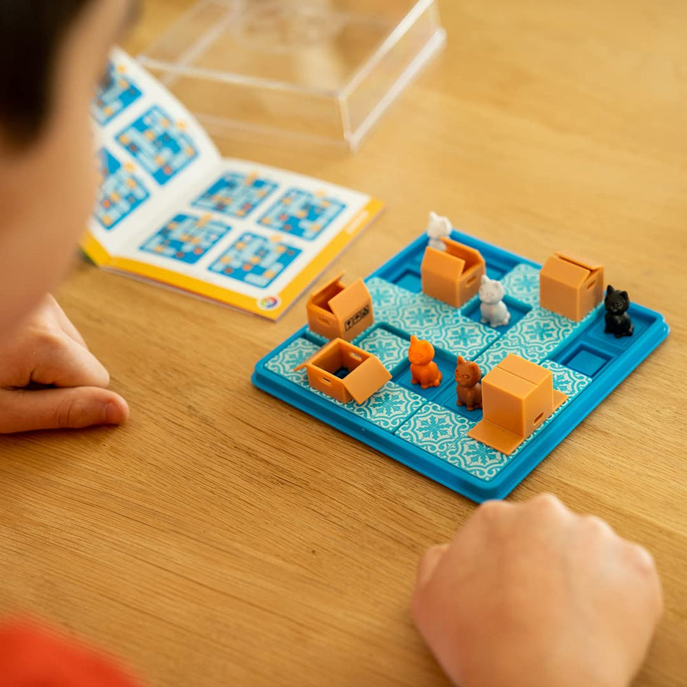 SmartGames Cats & Boxes pieces—ready for placement to solve the next challenge.