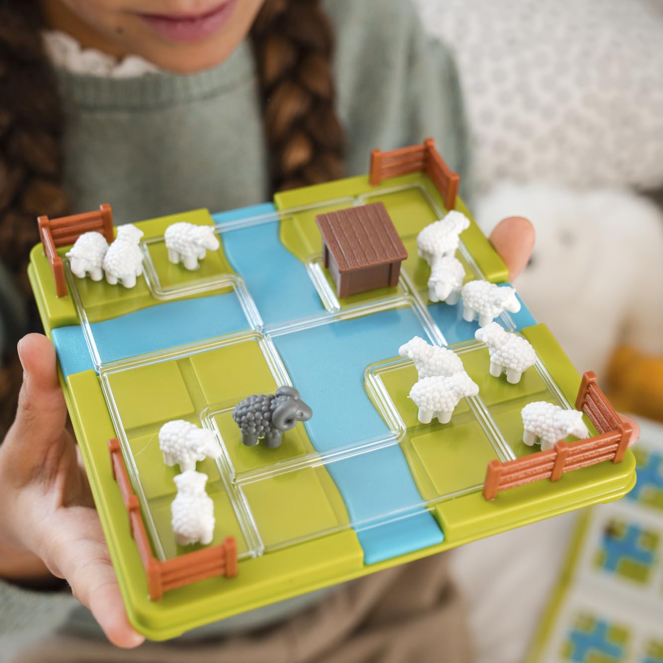 SmartGames Counting Sheep pieces ready for tactile play.