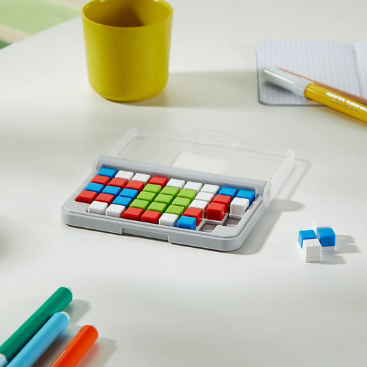 SmartGames IQ Focus color grid demonstrates color-placement puzzle on the 3x3 center.