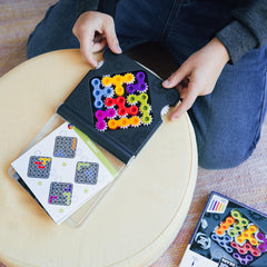 SmartGames IQ Gears gears twist to reveal solution, engaging logic skills during solo or family play.
