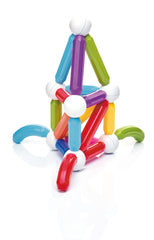 Young child building with Start Plus in bright playroom.