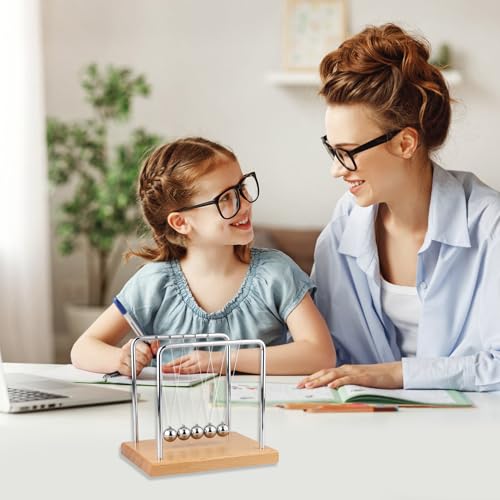 Smilesorg Newton's Cradle on a desk as elegant science-inspired decor and focus aid
