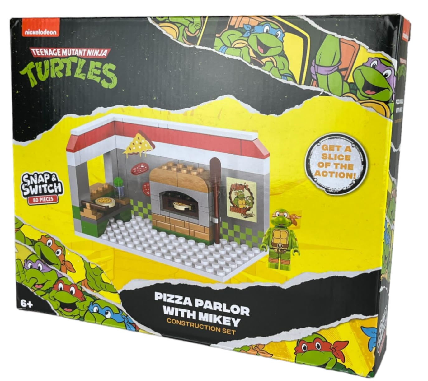 Snap and Switch Michelangelo figure included for interactive Ninja Turtles adventures.