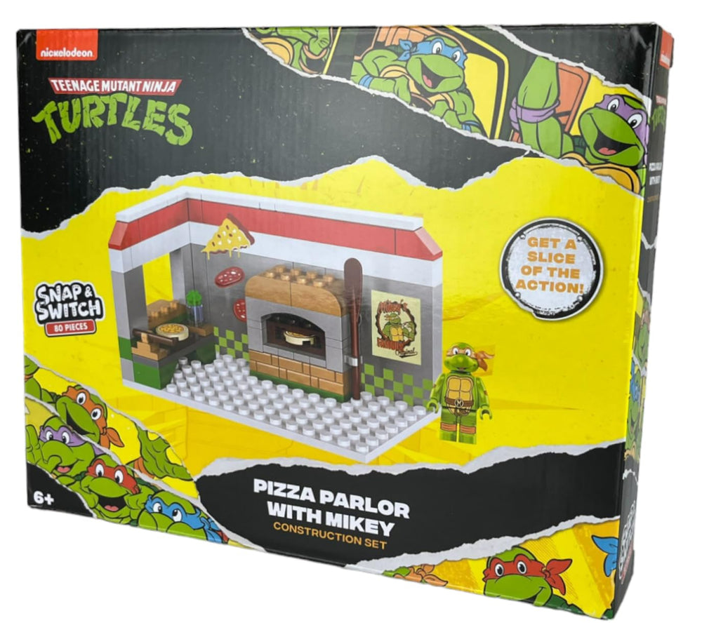 Snap and Switch Michelangelo figure included for interactive Ninja Turtles adventures.