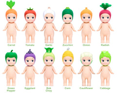 Sonny Angel vegetable headgear figure for display on shelves.