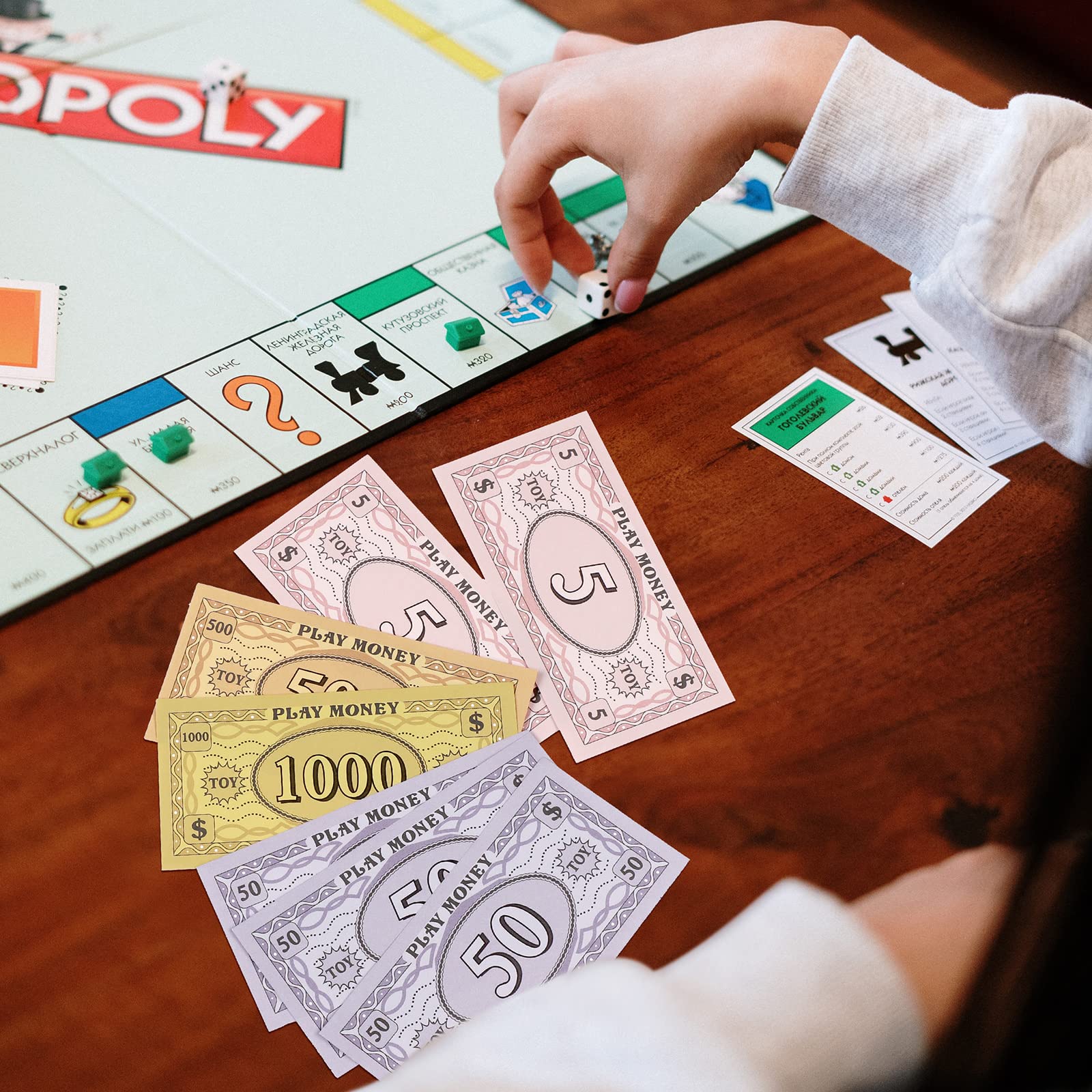 Sotiff play money as an educational tool to practice math in a fun pretend scenario.