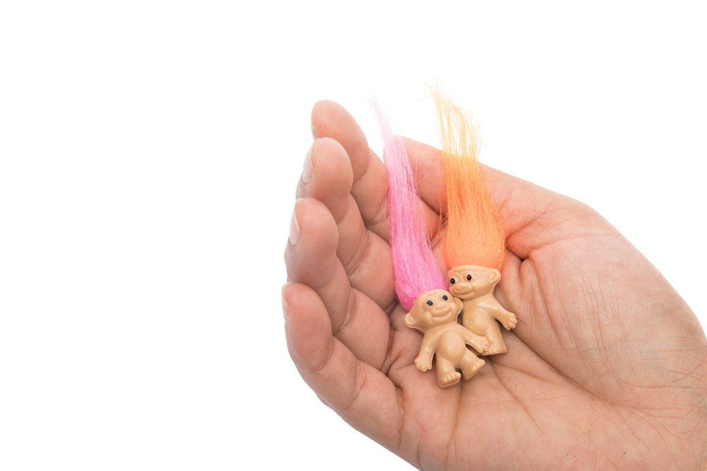 Sparkle Pins Lucky Troll dolls with long hair inviting styling and projects.