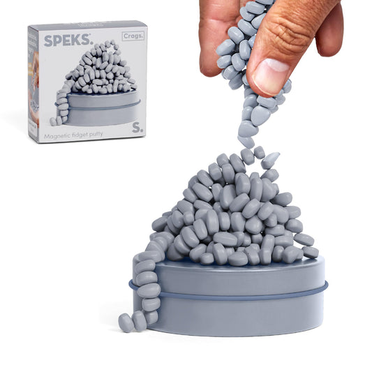 Speks Crags ferrite putty stones in a metal tin for tactile stress relief.