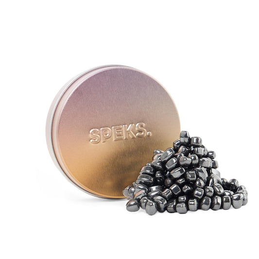 Speks Crags ferrite stones in a metal tin offer vibrant tactile focus.