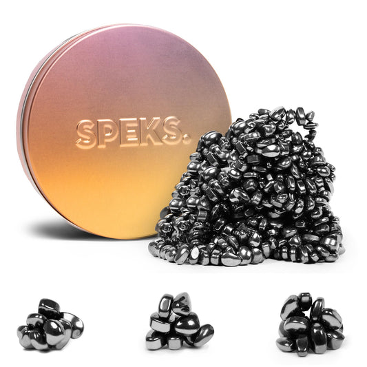Speks Crags ferrite stones in a tin offering tactile, mess-free stress relief at the desk