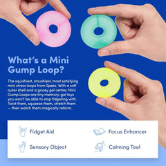 Speks Mini Gump Loop gel-filled stress balls in vibrant colors on desk