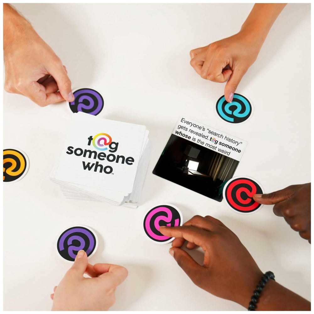 Spin Master Tag Someone Who meme cards deck sits center ready for play.