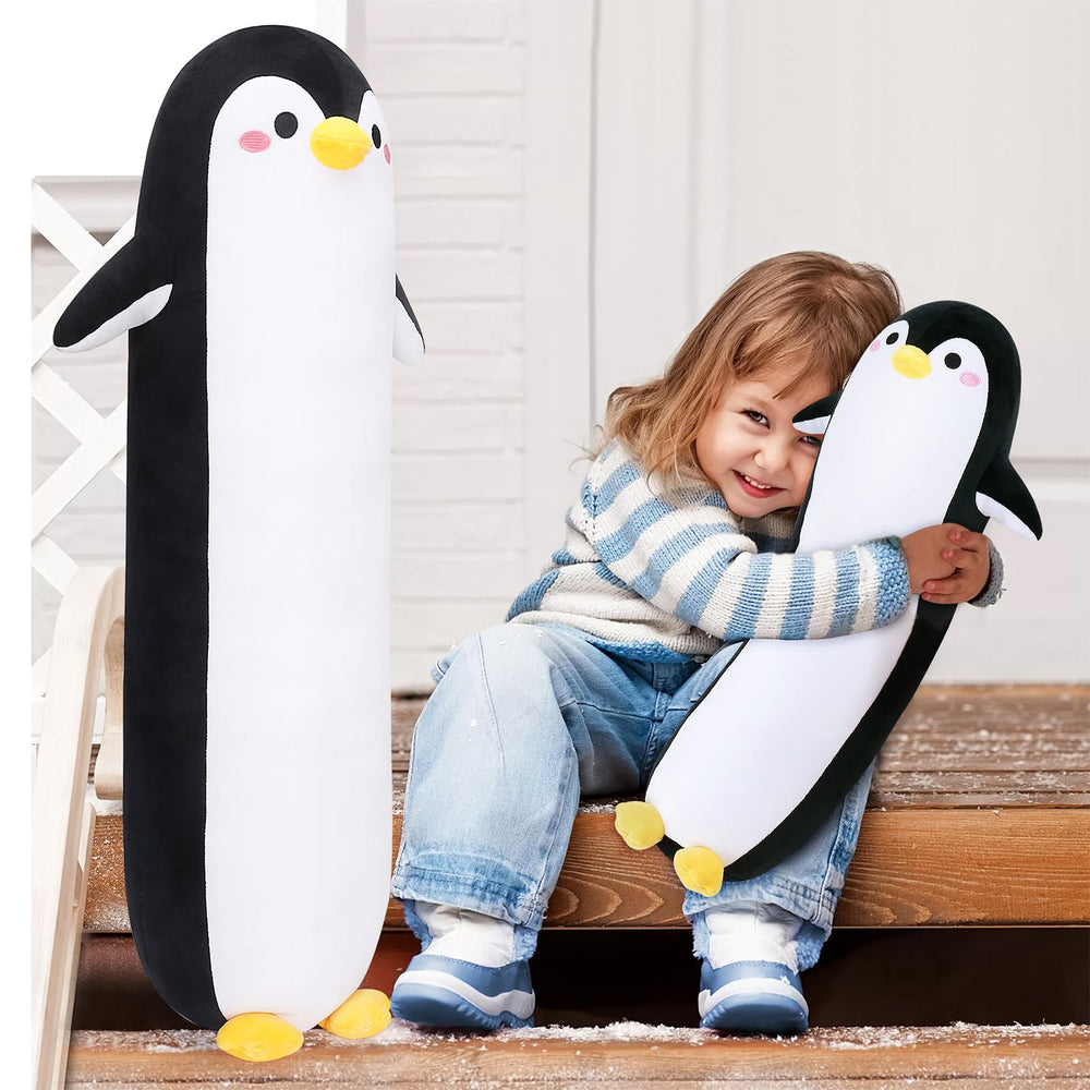 Sprinqdawin penguin pillow in a bedroom for relaxation.