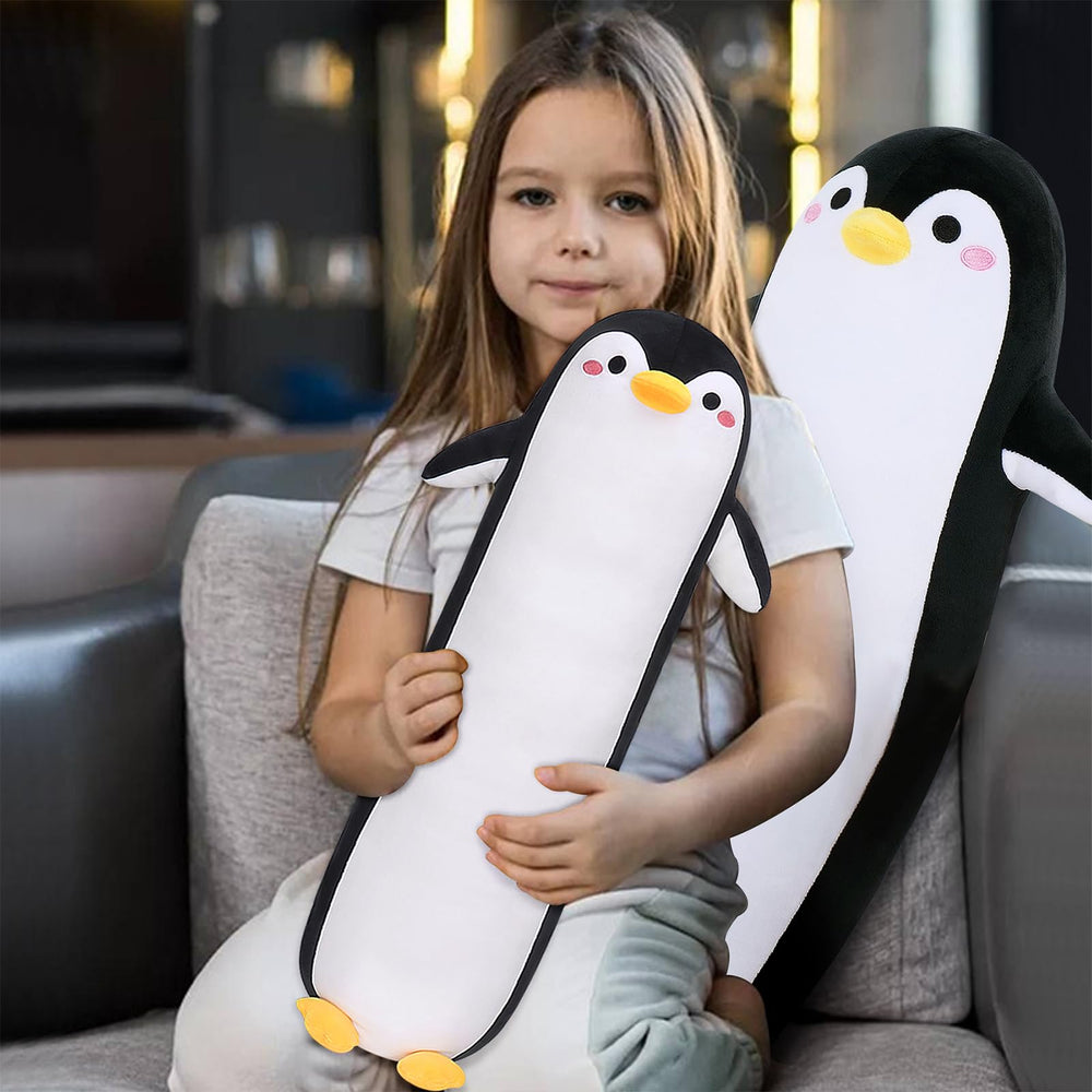 Sprinqdawin penguin pillow on sofa in a living room.