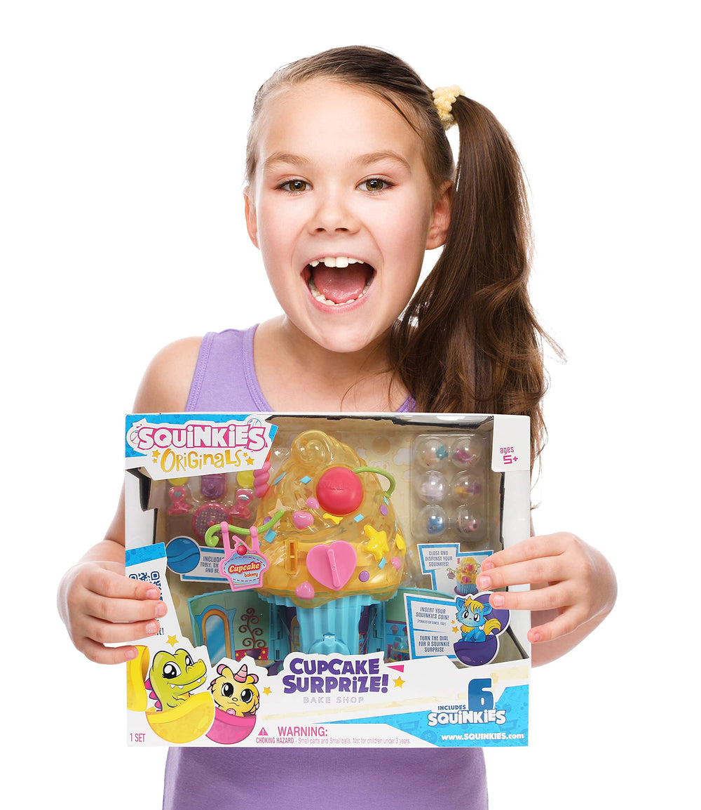 Squinkies Cupcake Surprise open cupcake shows bake shop inside for imaginative play.