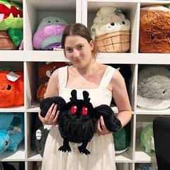 Squishable Mini Baby Mothman side view, perfect desk buddy and decor