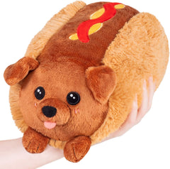 Squishable Mini Dachshund Hot Dog on desk, cozy snuggle buddy