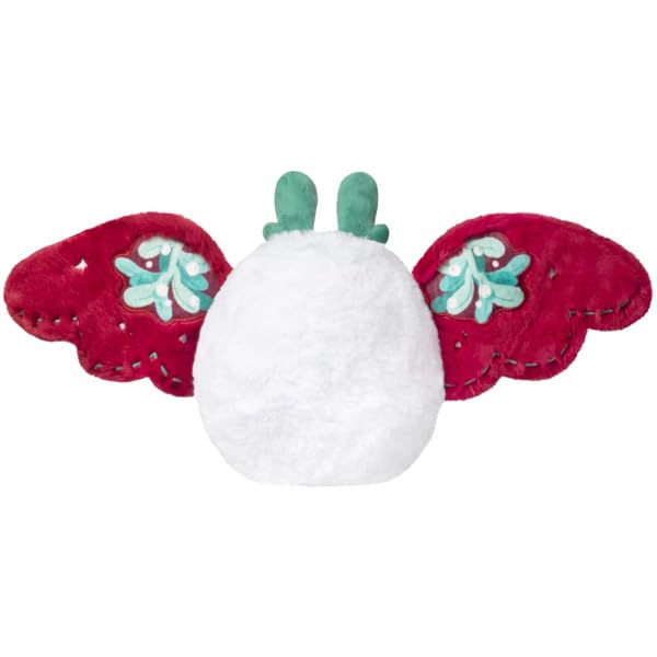 Squishable Mini Mistletoe Baby Mothman perched at a desk for cozy companionship.