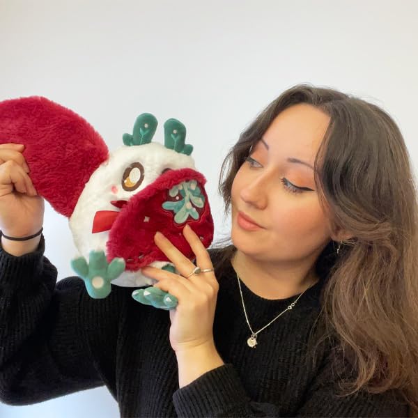 Squishable Mini Mistletoe Baby Mothman on a shelf adding playful decor.