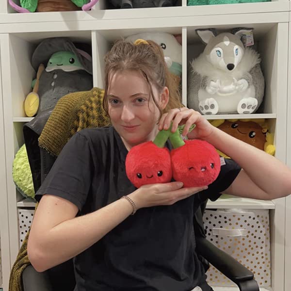 Squishable Snugglemi Snacker Cherries resting on a shelf for cozy decor