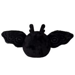 Squishable Snugglemi Snackers Baby Mothman on-desk scene, cozy study buddy.