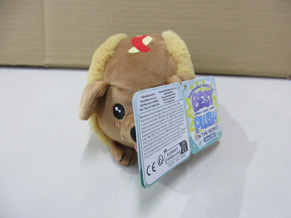 Squishable Snugglemi Snackers Dachshund Hot Dog on desk, sensory-friendly desk companion.