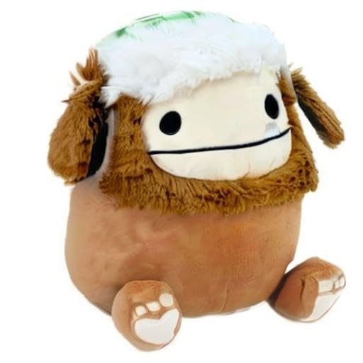 Squishmallows Benny the Bigfoot with blue scarf, soft companion for bedtime stories.