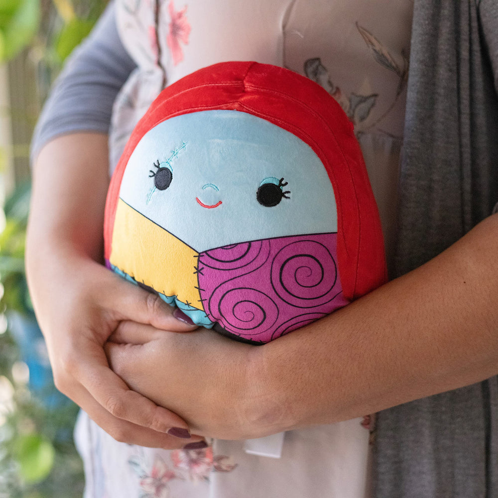 Squishmallows Sally snuggle in hand, ideal for car rides and sleepovers.