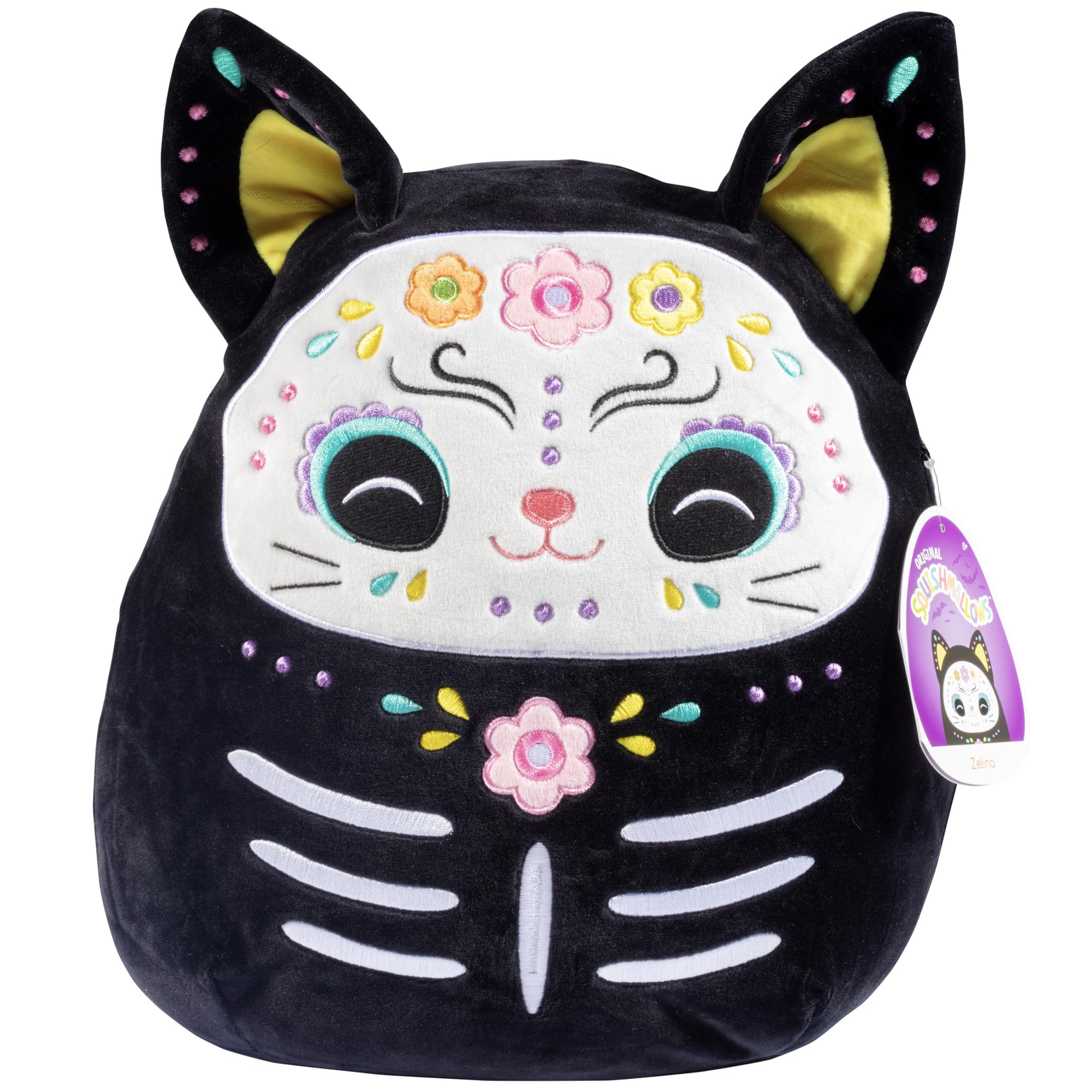 Squishmallows Zelina Day of the Dead Cat perched on a shelf for seasonal cuddles.