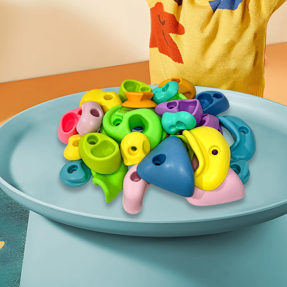 SREHRLY pastel climbing holds provide tactile grip for kids.