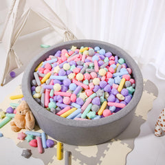 Close-up of STARBOLO Macaron balls showing thick, durable plastic for long play