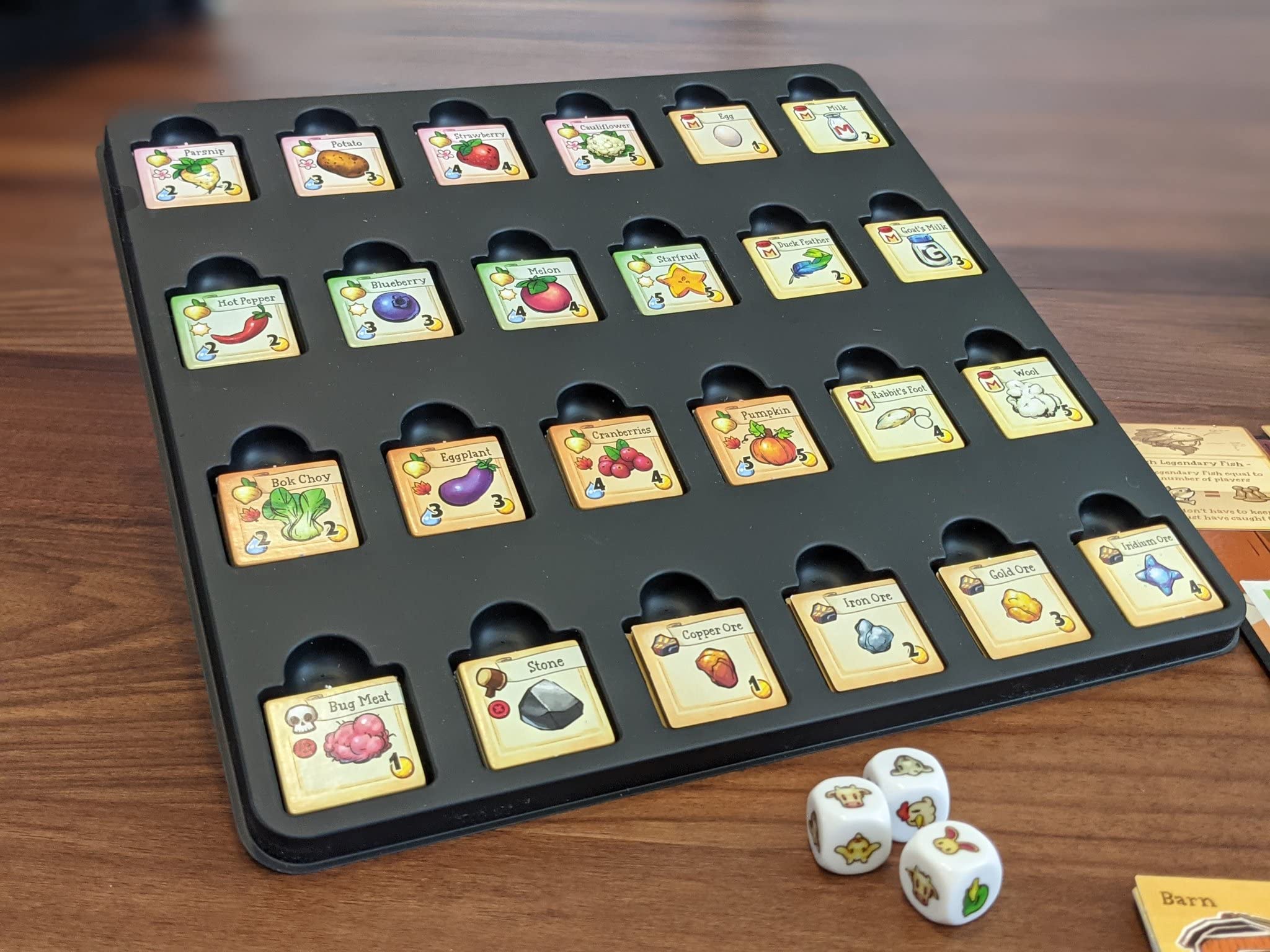 Stardew Valley Board Game waterfront fishing scene emphasizes relaxing fishing moments.