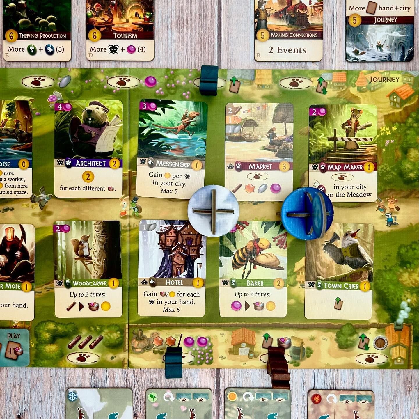 Sun and moon tokens from Everdell Duo adding dynamic timing to play