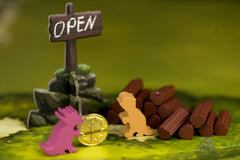 Starling Games Pearlbrook wooden frogs add tactile charm to river battles.