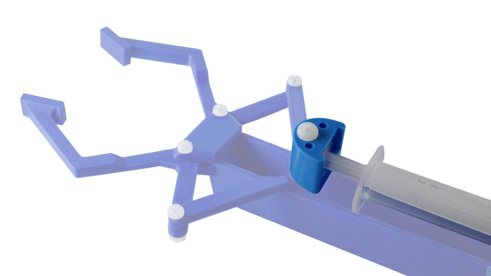 STEM Inventions bionic-hand demo image: hydraulic-powered hand prototype for learning.