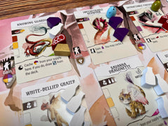 Stonemaier Wyrmspan resources on table showcase vibrant components