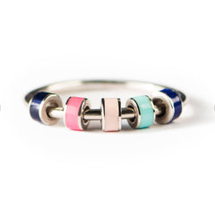 STORYJEWELLERY fidget ring closeup shows smooth, discreet spin for anxiety-friendly use.
