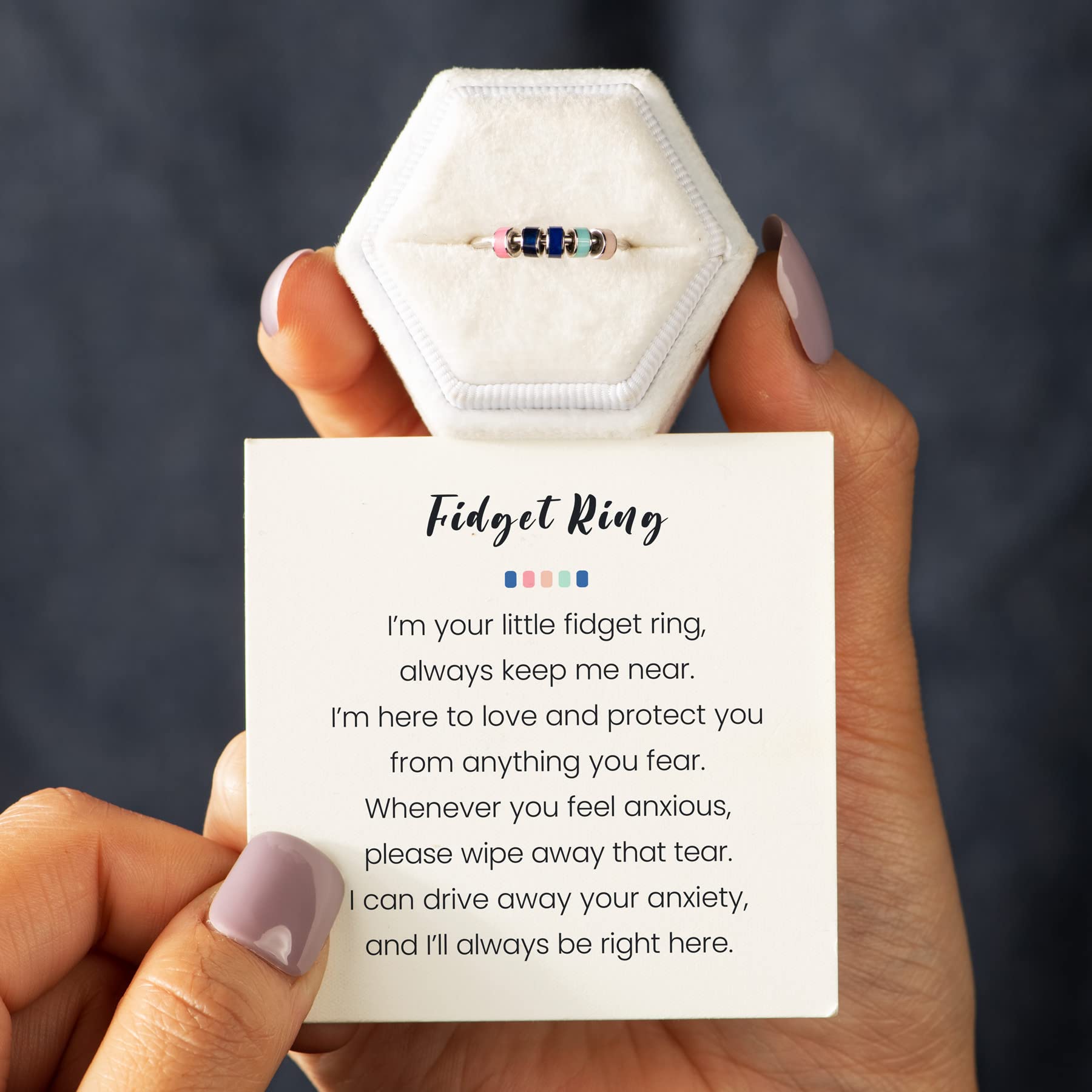 STORYJEWELLERY silent spin ring on finger highlights discreet ongoing wear.