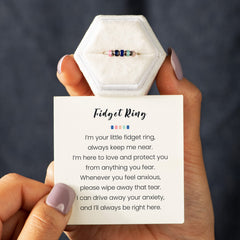 STORYJEWELLERY silent spin ring on finger highlights discreet ongoing wear.