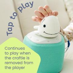 Storypod Raffi Baby Beluga listening with headphones shows calm, focused listening sessions.