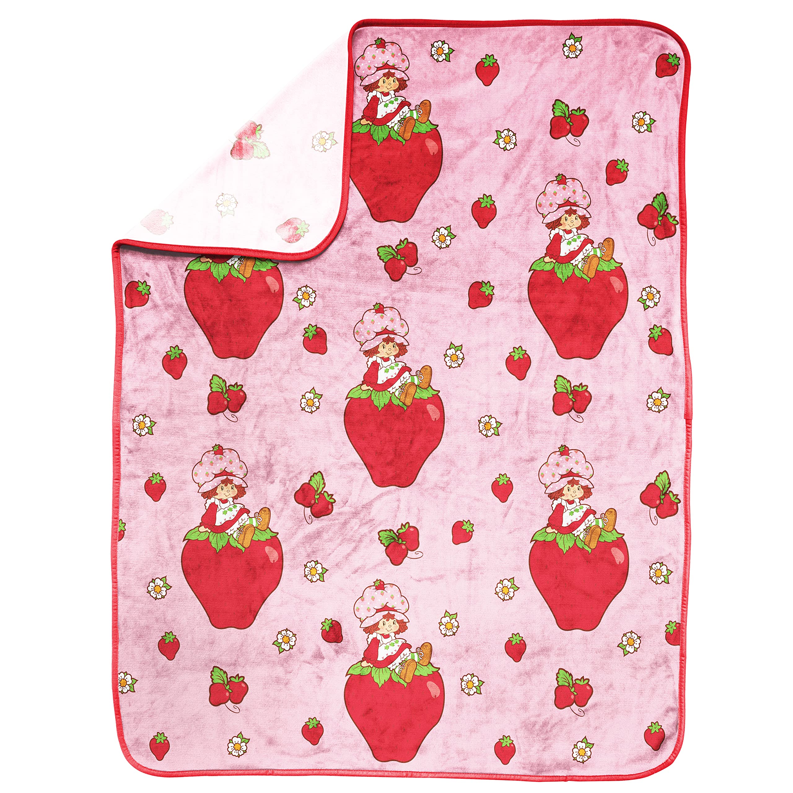 Strawberry Shortcake soft-fleece blanket close-up highlights plush texture