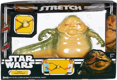 STRETCH ARMSTRONG Jabba being stretched in hand demonstrating durable elasticity