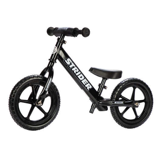 Strider 12-inch balance bike side view shows easy maneuverability for beginners.