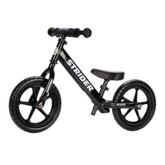 Strider 12-inch balance bike side view shows easy maneuverability for beginners.