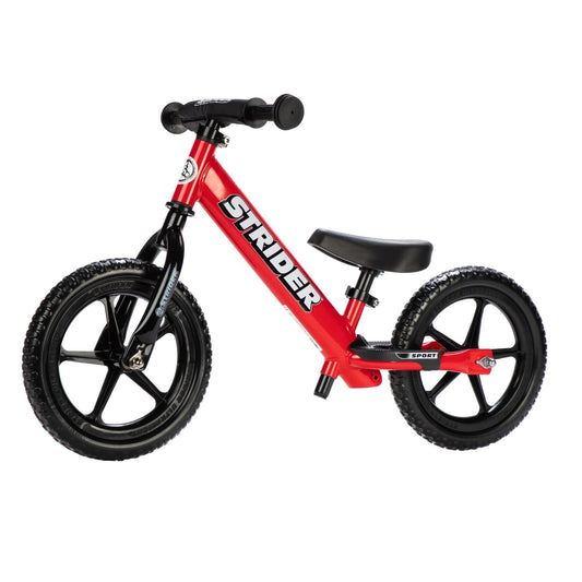 Strider 12” Sport Bike red front view showing compact balance frame for toddlers.